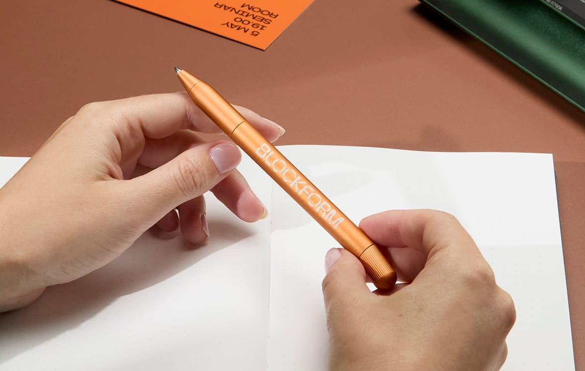 MOO Twist Pen with a Notebook on display