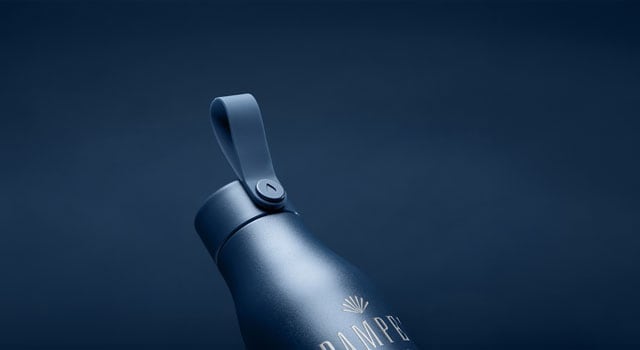 A branded MOO Water Bottle in Midnight Blue